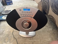 Used 2000s Radio (FM/AM capability), CD player, Alarm,Can Be Hung Flat On Wall