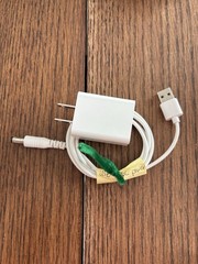 white AC-to-DC wall power adapter and USB-barrel connector cable.