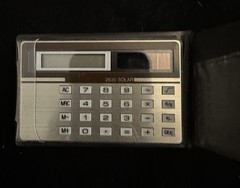 IBM calculator, with case, 3 inches X 2 inches. solar powered