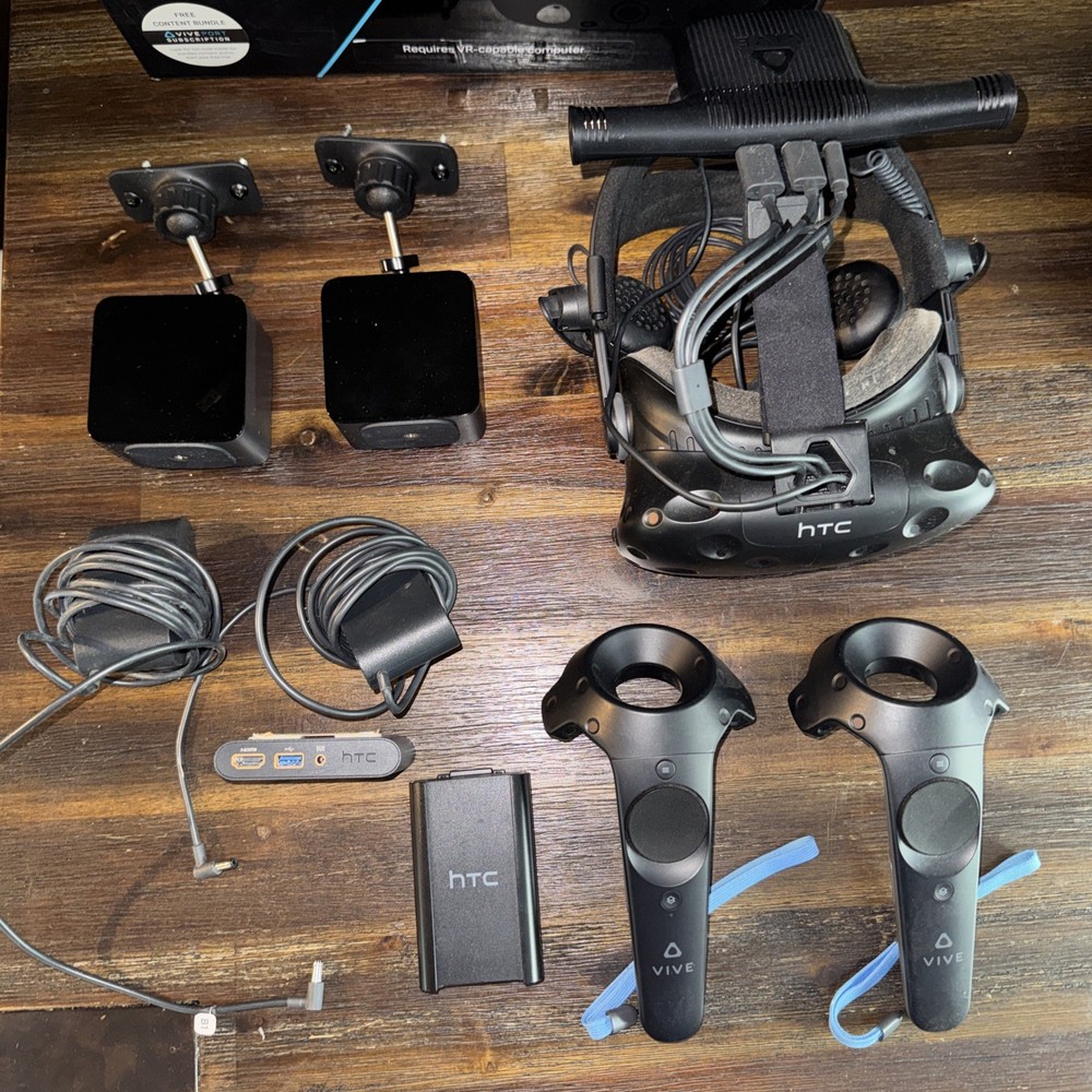 HTC Vive with controllers, deluxe headset strap, and wireless adapter