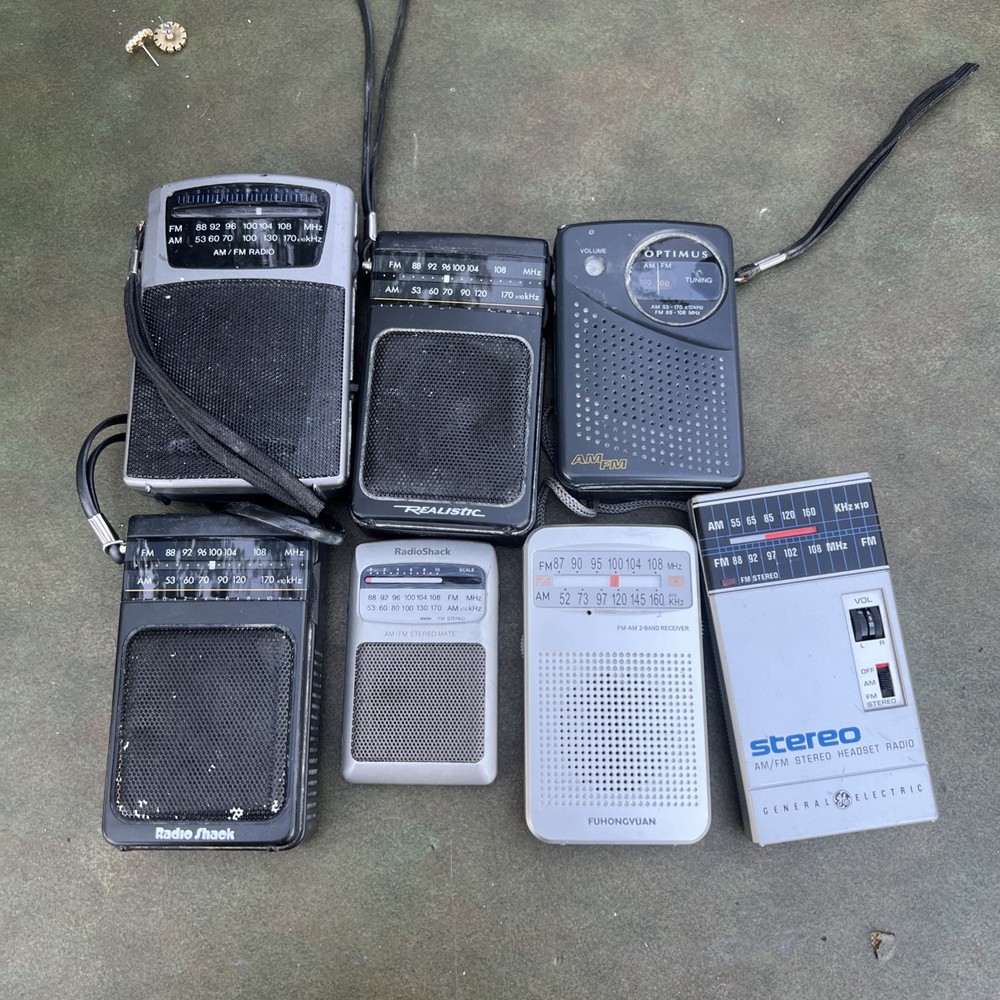 Lot of 7 Mixed AM/FM Pocket Radios Several Models Portable Handheld Most Working